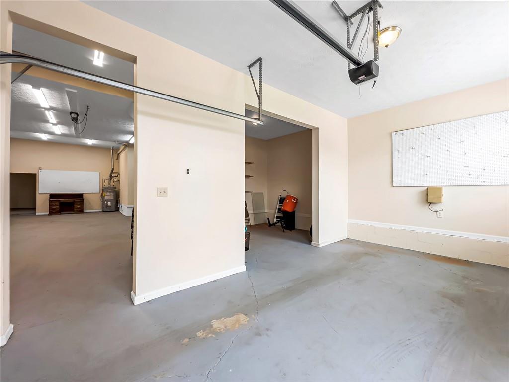 335 Canvasback Trail Locust Grove, GA 30248 - Photo 10 of 91 a view of a storage & utility room with a window