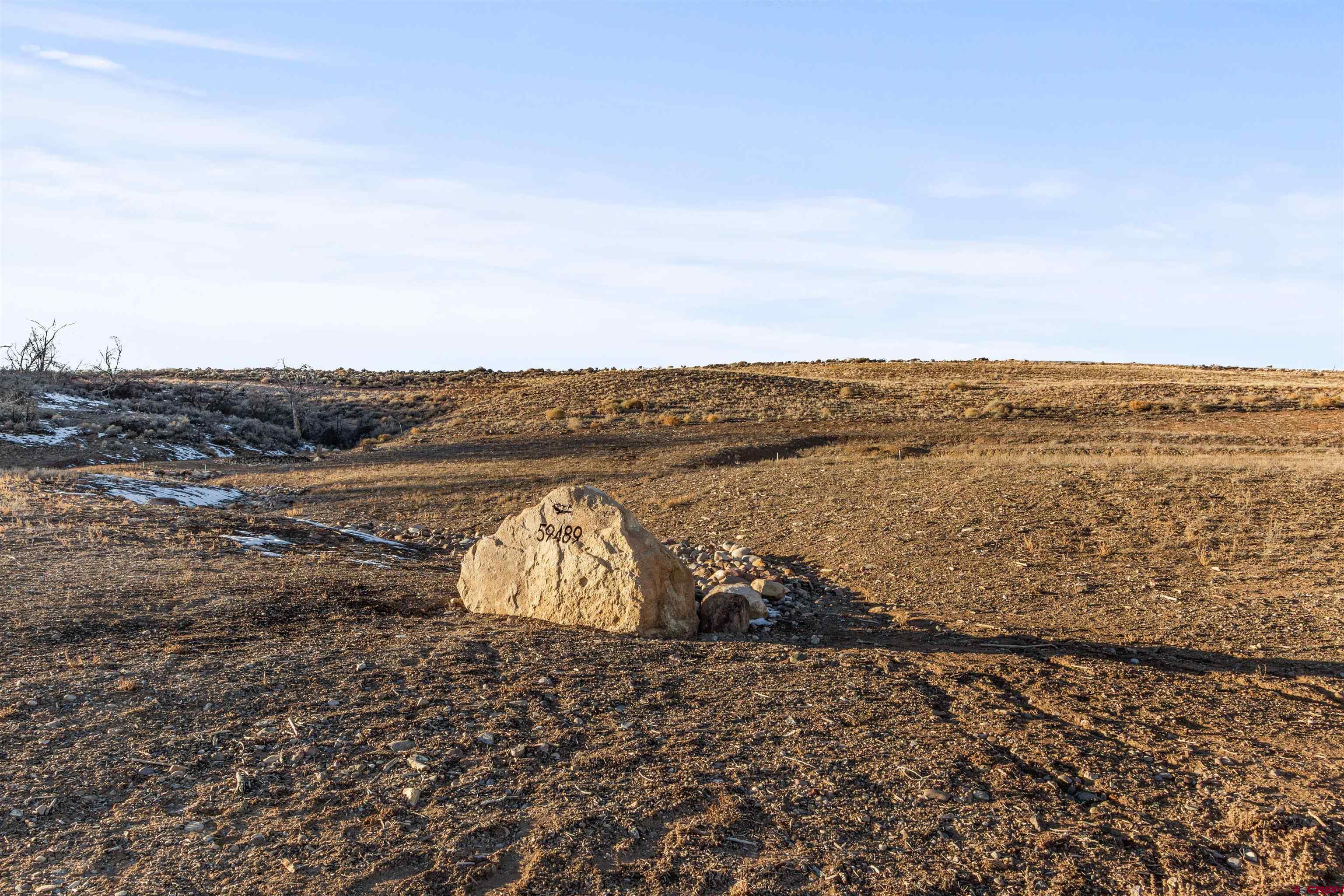 Lot 9 Lone Eagle Road Montrose, CO 81403 - Photo 16 of 21 a view of a large body of water with a building in the background