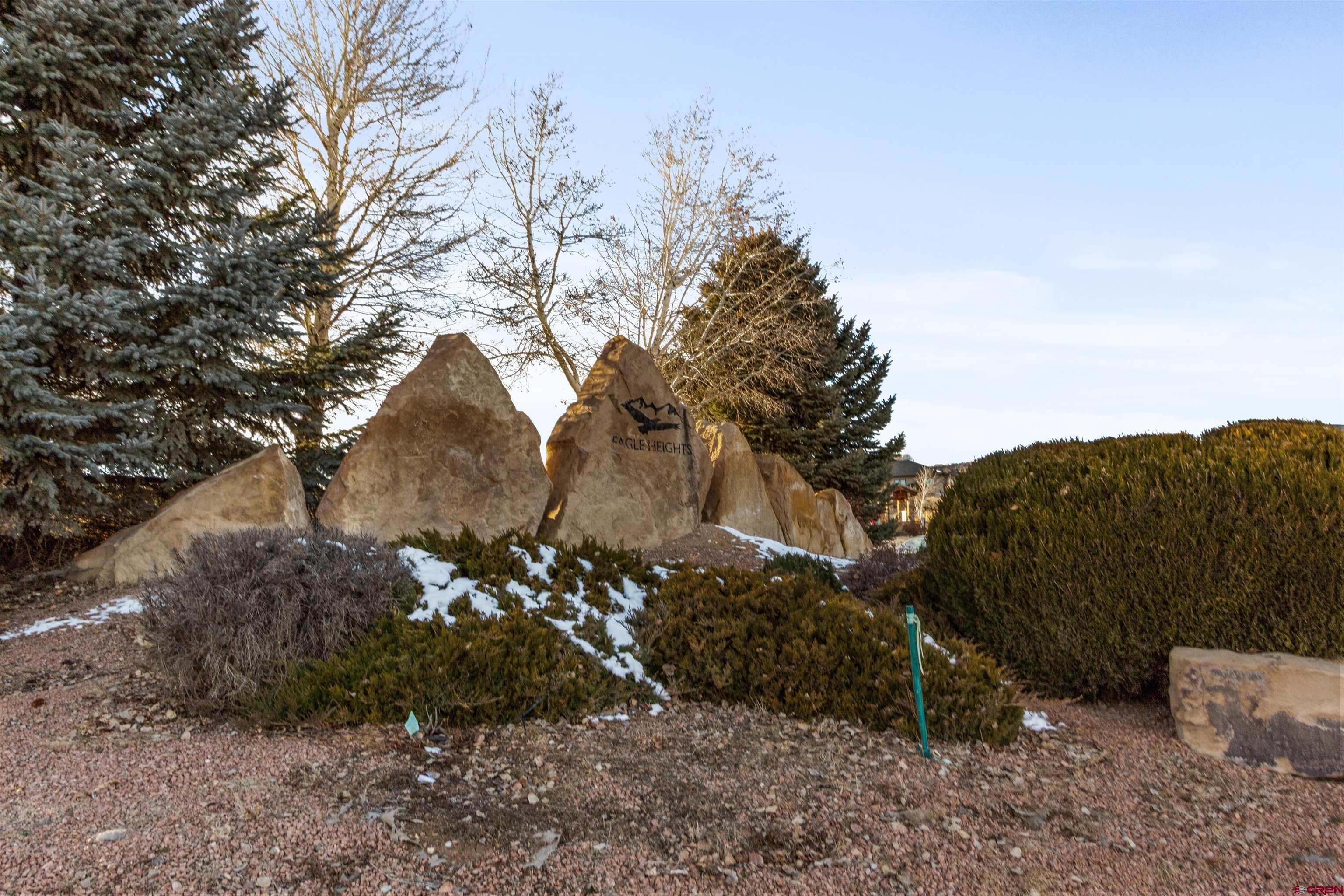 Lot 9 Lone Eagle Road Montrose, CO 81403 - Photo 20 of 21 a view of a house with a yard and covered with snow