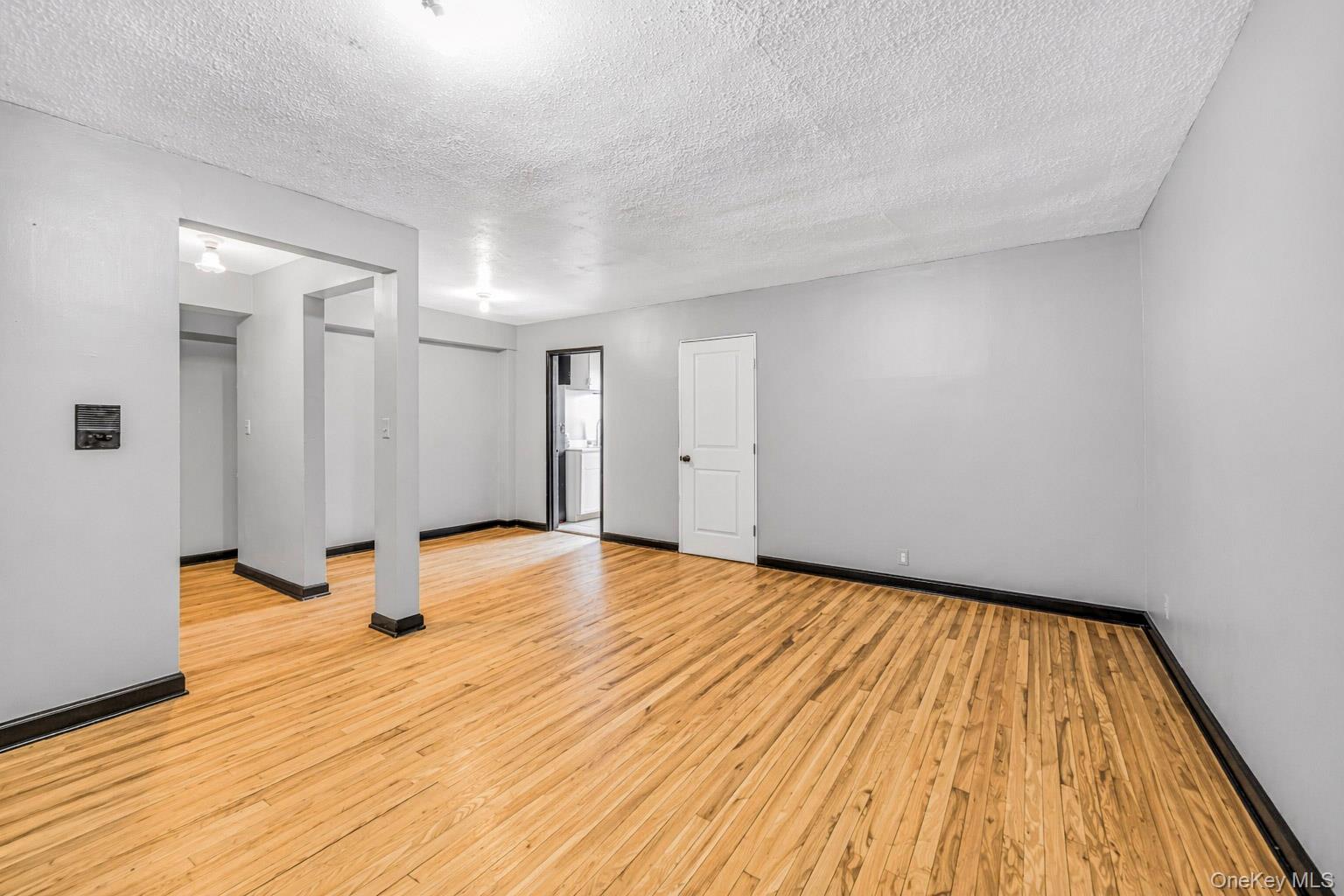 150 Ravine Avenue, Unit 3B Yonkers, NY 10701 - Photo 3 of 9 a view of empty room with wooden floor