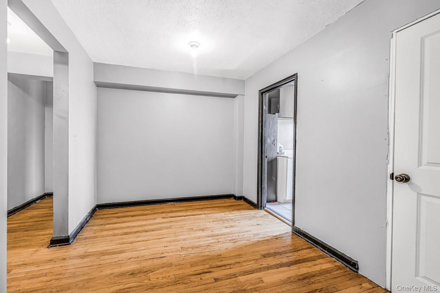 150 Ravine Avenue, Unit 3B Yonkers, NY 10701 - Photo 4 of 9 a view of empty room with wooden floor