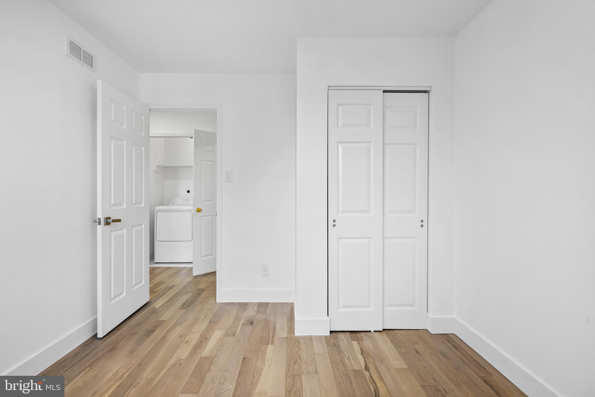 1007 Stoneham Drive, Unit 1007B Newtown Square, PA 19073 - Photo 18 of 31 a view of a room with wooden floor