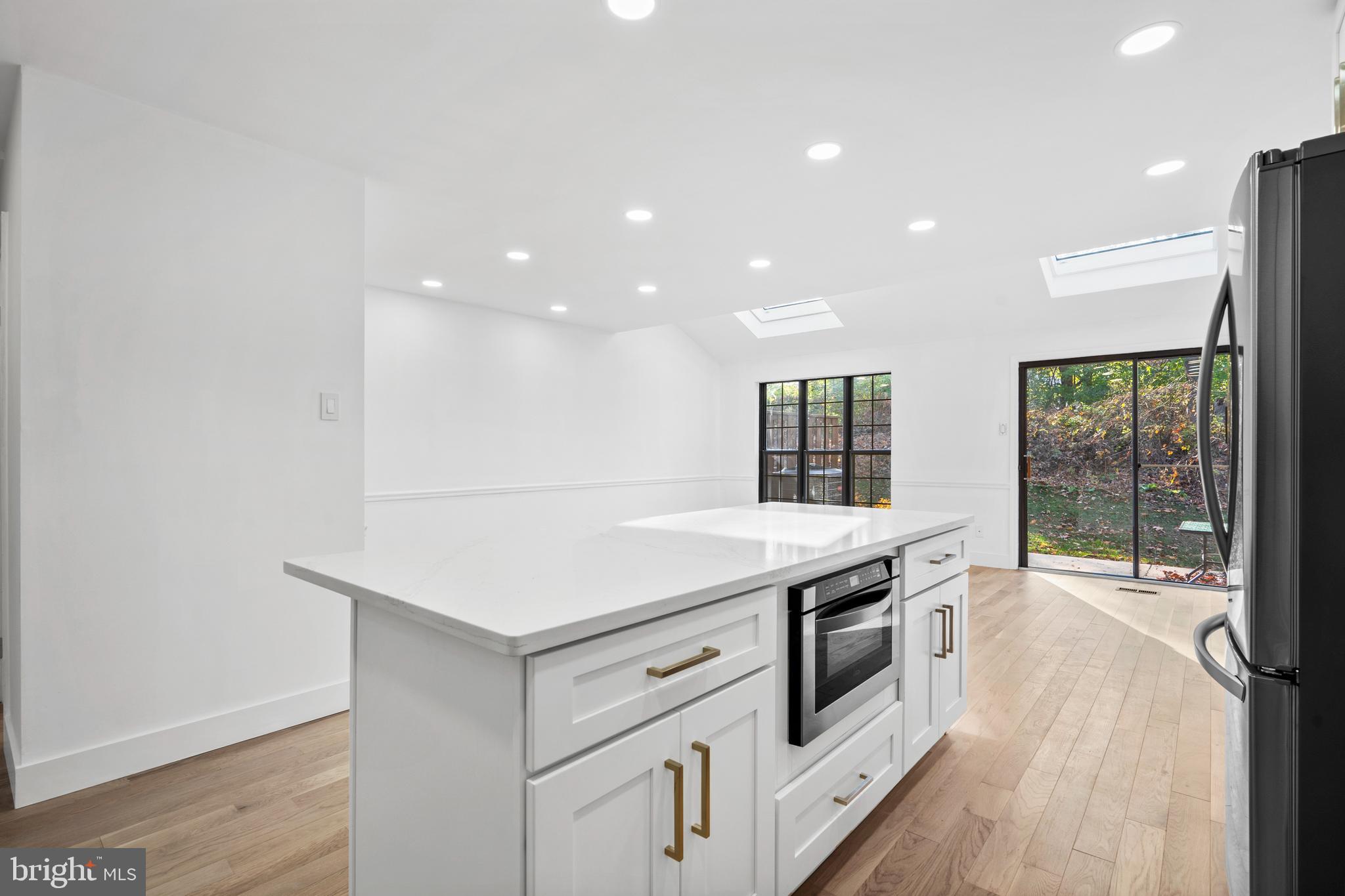 1007 Stoneham Drive, Unit 1007B Newtown Square, PA 19073 - Photo 2 of 31 a kitchen with a stove and a sink