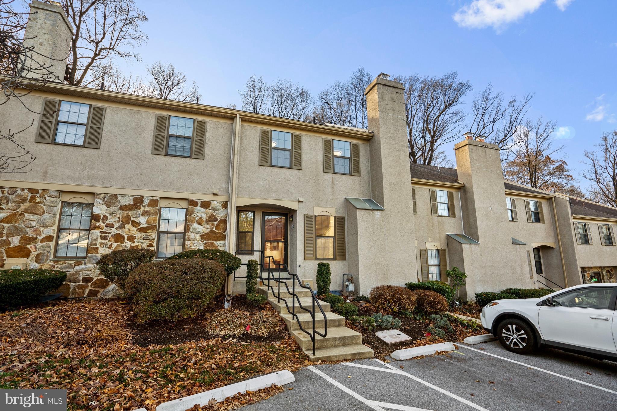 1007 Stoneham Drive, Unit 1007B Newtown Square, PA 19073 - Photo 24 of 31 a view of a car park in front of a house