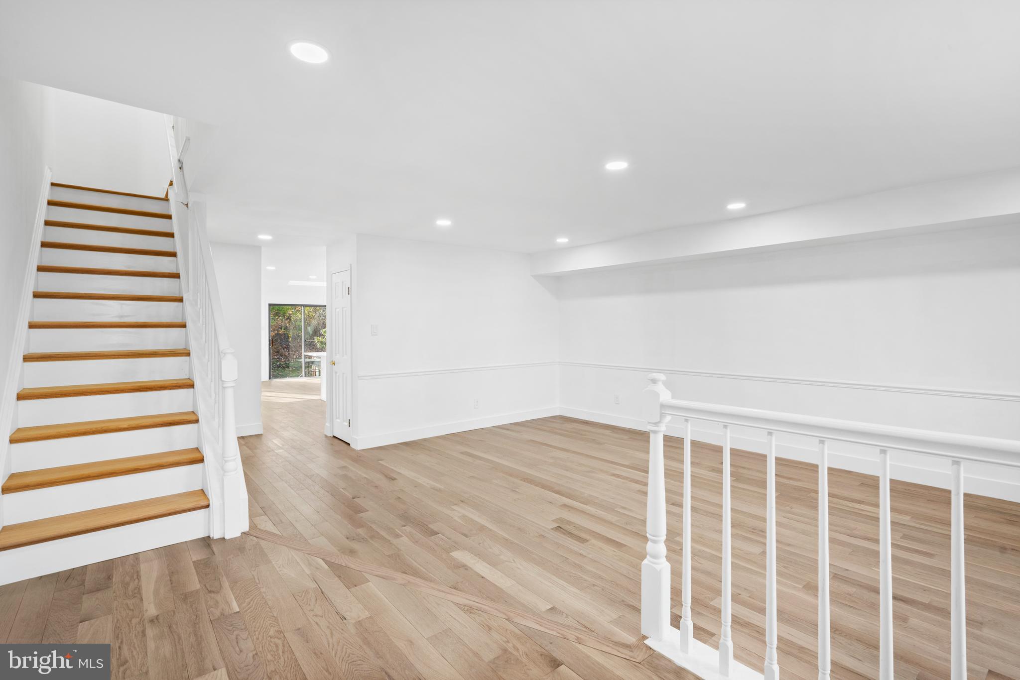 1007 Stoneham Drive, Unit 1007B Newtown Square, PA 19073 - Photo 10 of 31 a view of empty room with wooden floor