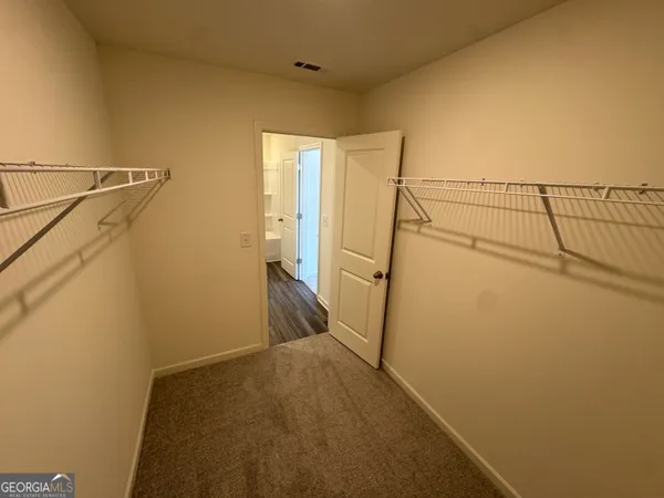 a view of storage and utility room with a sink