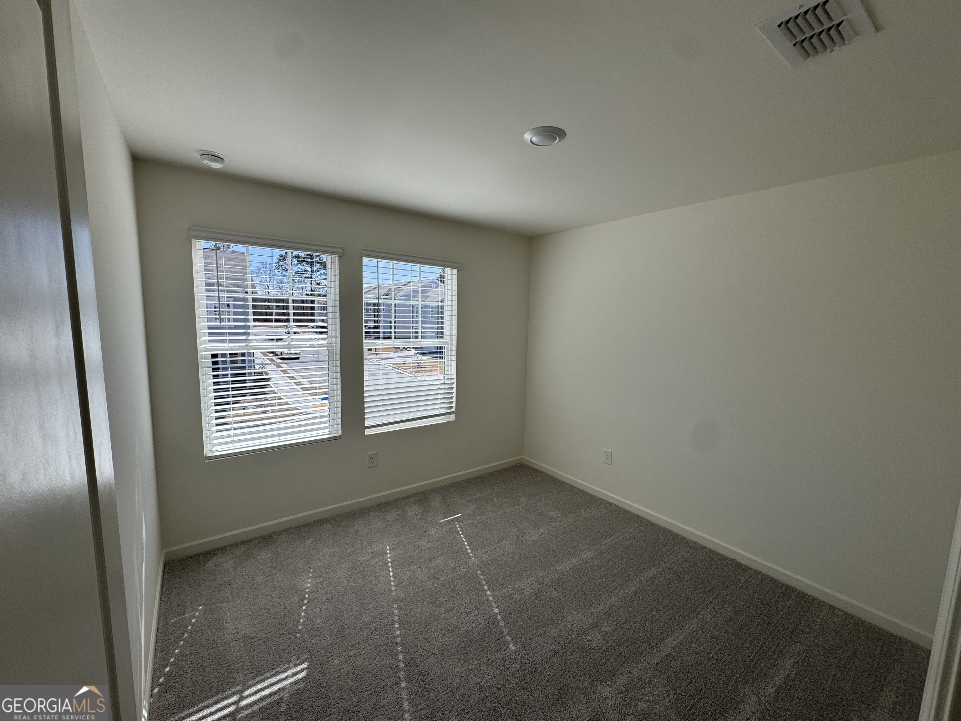 423 Towson Street, Unit 233 Villa Rica, GA 30180 - Photo 13 of 18 a view of an empty room with a window