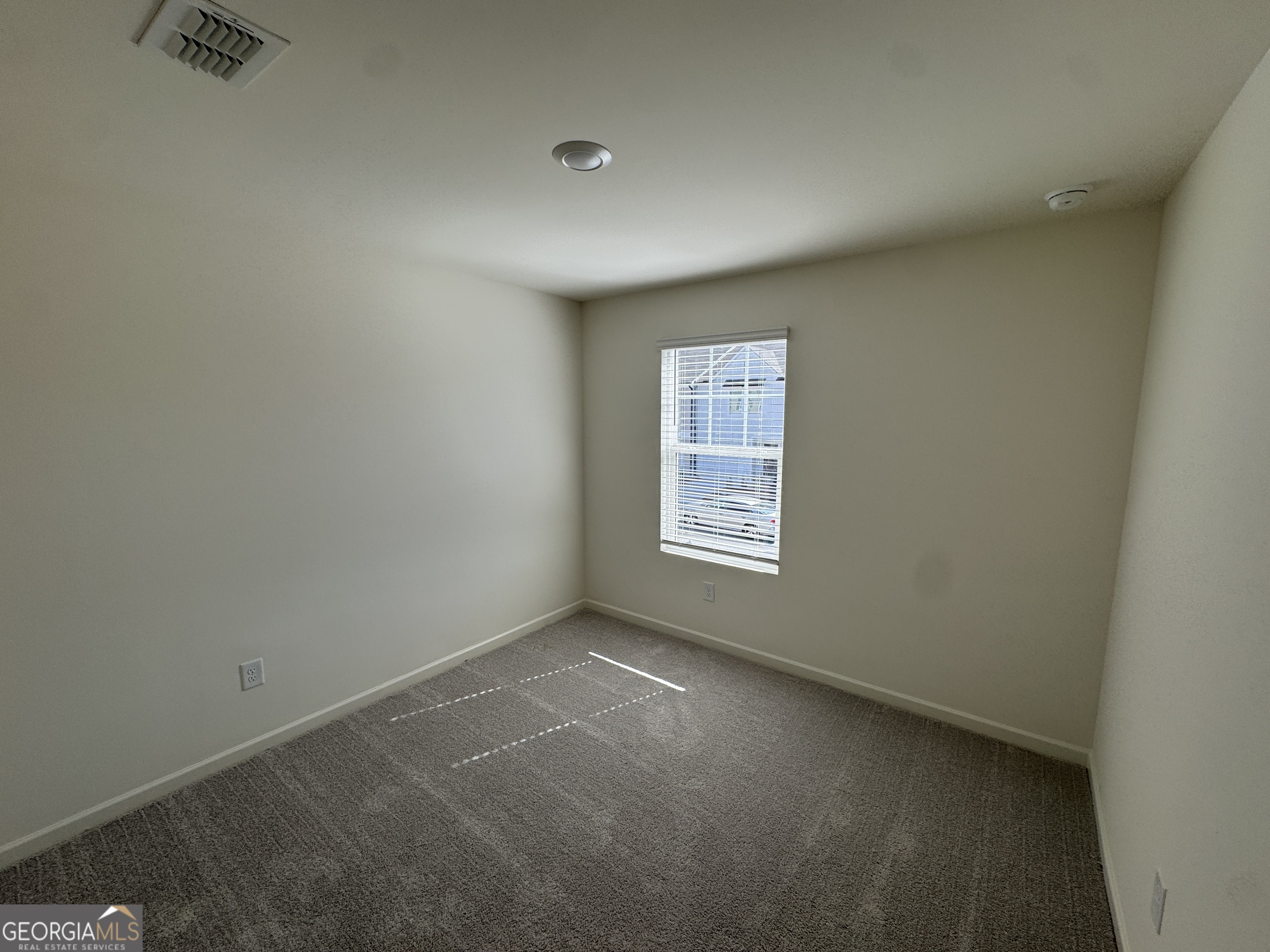 423 Towson Street, Unit 233 Villa Rica, GA 30180 - Photo 14 of 18 an empty room with a window