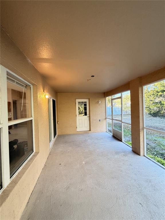 4 Wheeldon Lane Palm Coast, FL 32164 - Photo 20 of 21 a view of an empty room with a fireplace and a window