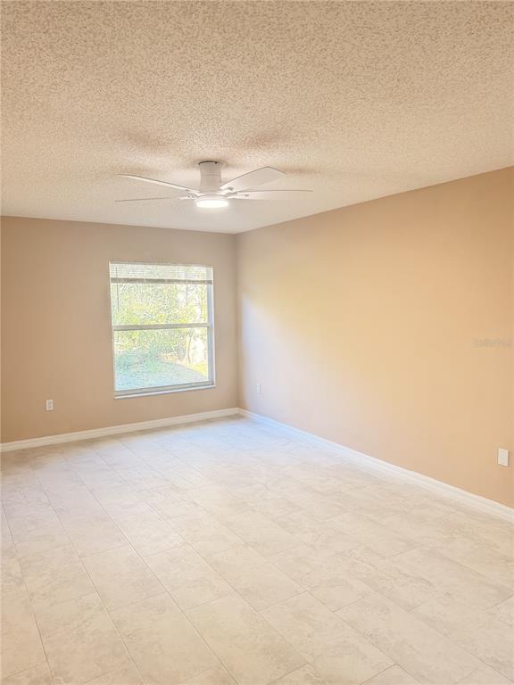 4 Wheeldon Lane Palm Coast, FL 32164 - Photo 6 of 21 an empty room with a empty space and windows