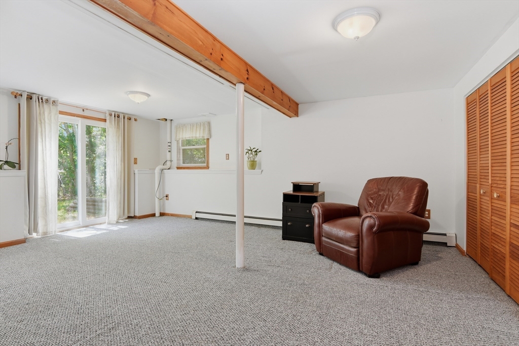 8 Emerald Way Sandwich, MA 02644 - Photo 24 of 36 a living room with furniture and a window