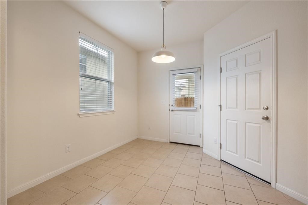5428 Falling Leaf Lane, Unit 87 Austin, TX 78744 - Photo 12 of 31 a view of an empty room with a window
