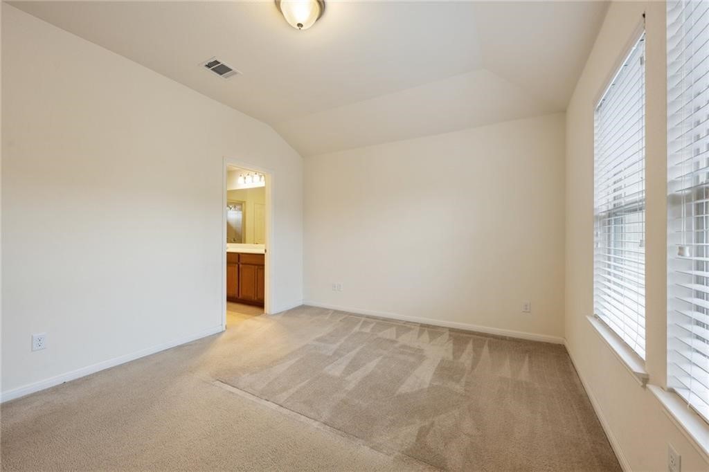 5428 Falling Leaf Lane, Unit 87 Austin, TX 78744 - Photo 14 of 31 a view of an empty room with a window