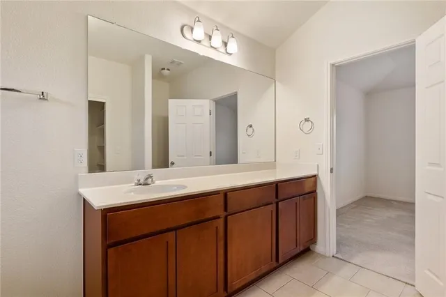 a spacious bathroom with a double vanity sink mirror and double