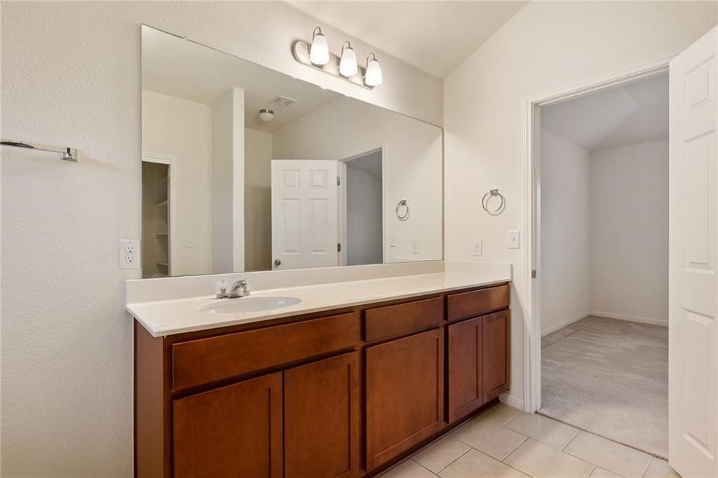 5428 Falling Leaf Lane, Unit 87 Austin, TX 78744 - Photo 20 of 31 a spacious bathroom with a double vanity sink mirror and double