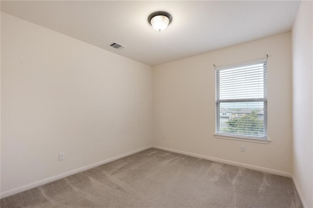 5428 Falling Leaf Lane, Unit 87 Austin, TX 78744 - Photo 22 of 31 an empty room with a window