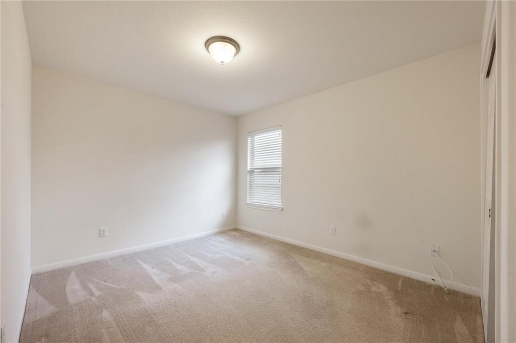 5428 Falling Leaf Lane, Unit 87 Austin, TX 78744 - Photo 23 of 31 a view of an empty room and window