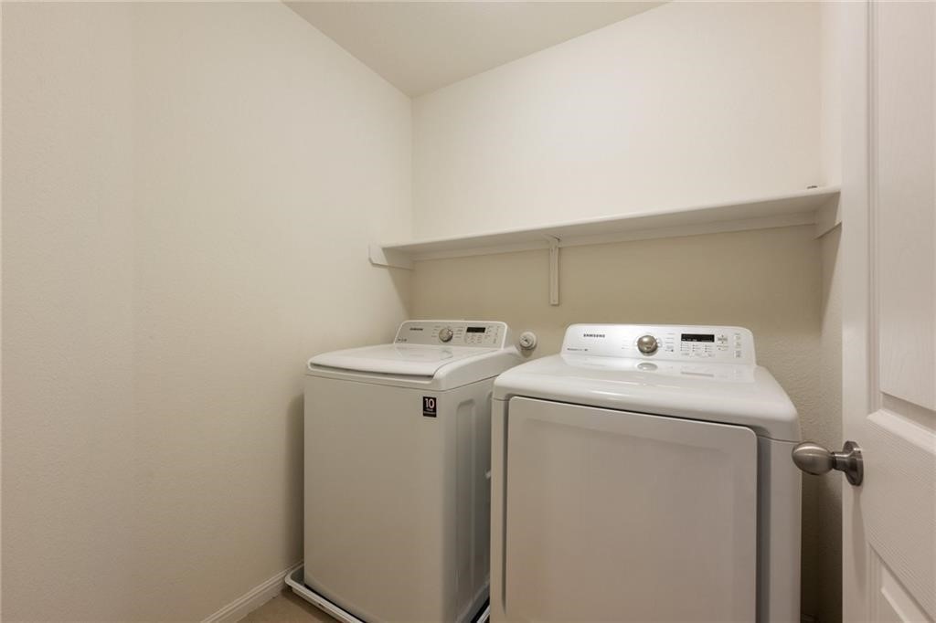 5428 Falling Leaf Lane, Unit 87 Austin, TX 78744 - Photo 26 of 31 a utility room with dryer and washer