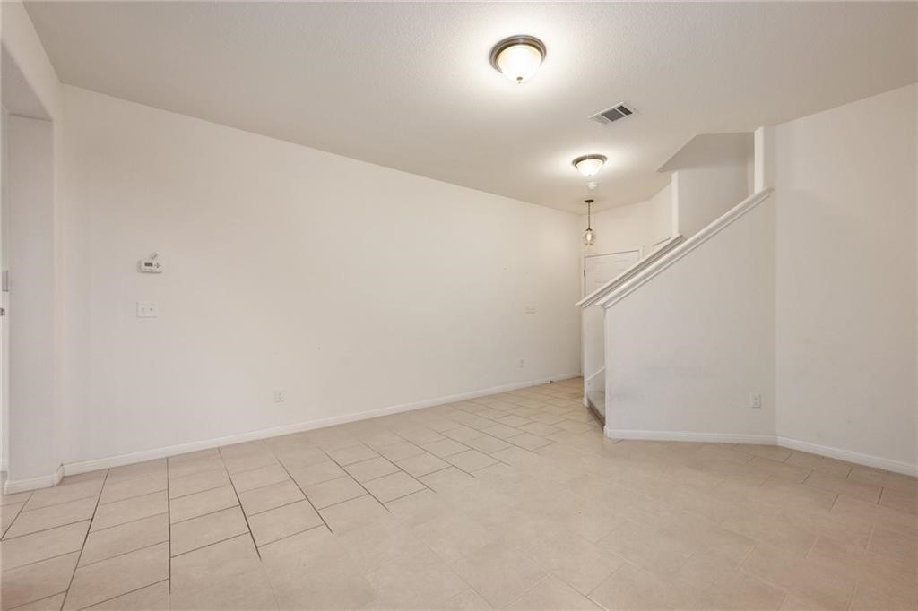 5428 Falling Leaf Lane, Unit 87 Austin, TX 78744 - Photo 7 of 31 wooden floor in an empty room