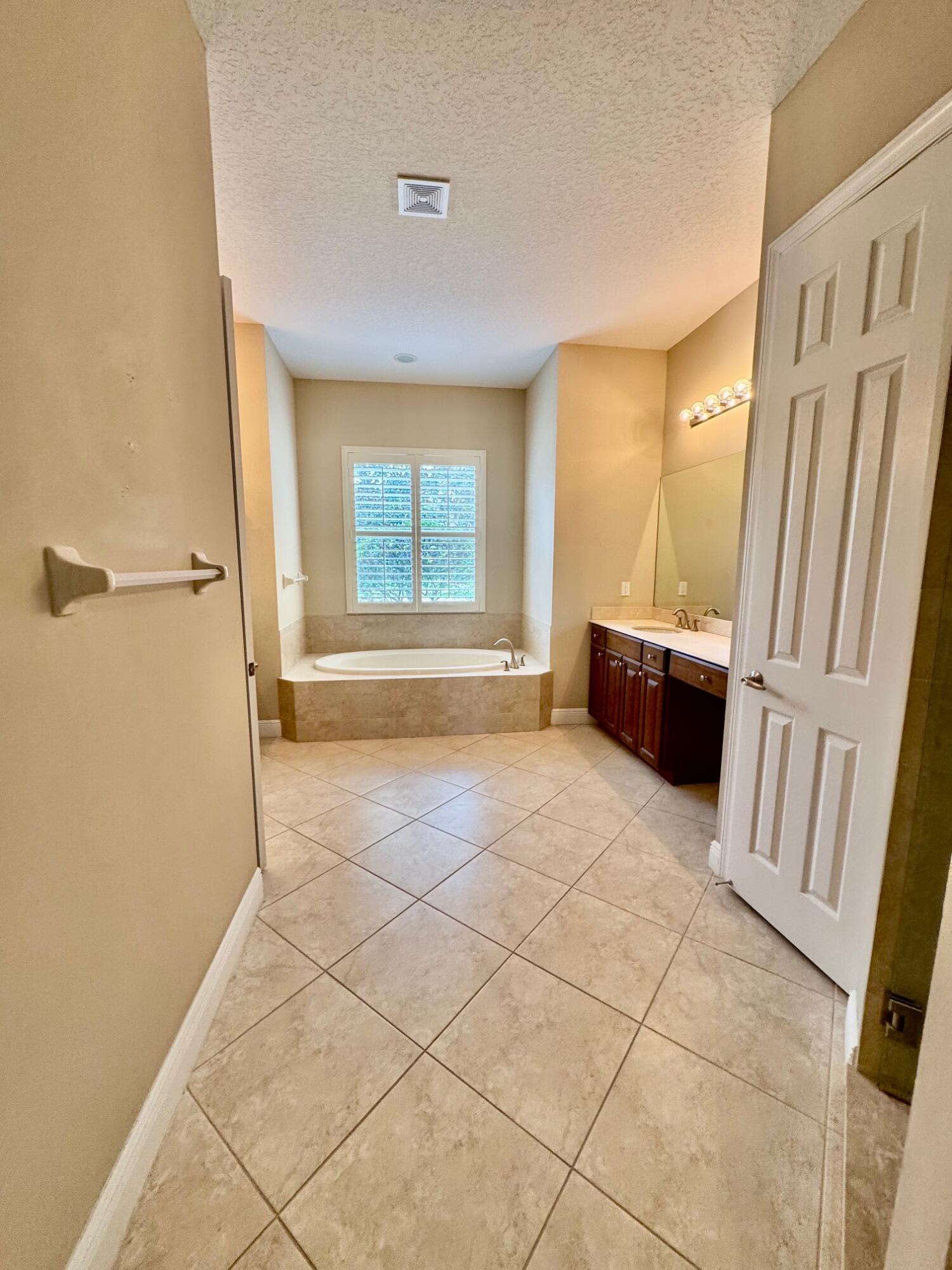 243 Southeast Ethan Terrace Stuart, FL 34997 - Photo 28 of 58 a view of an empty room with a window