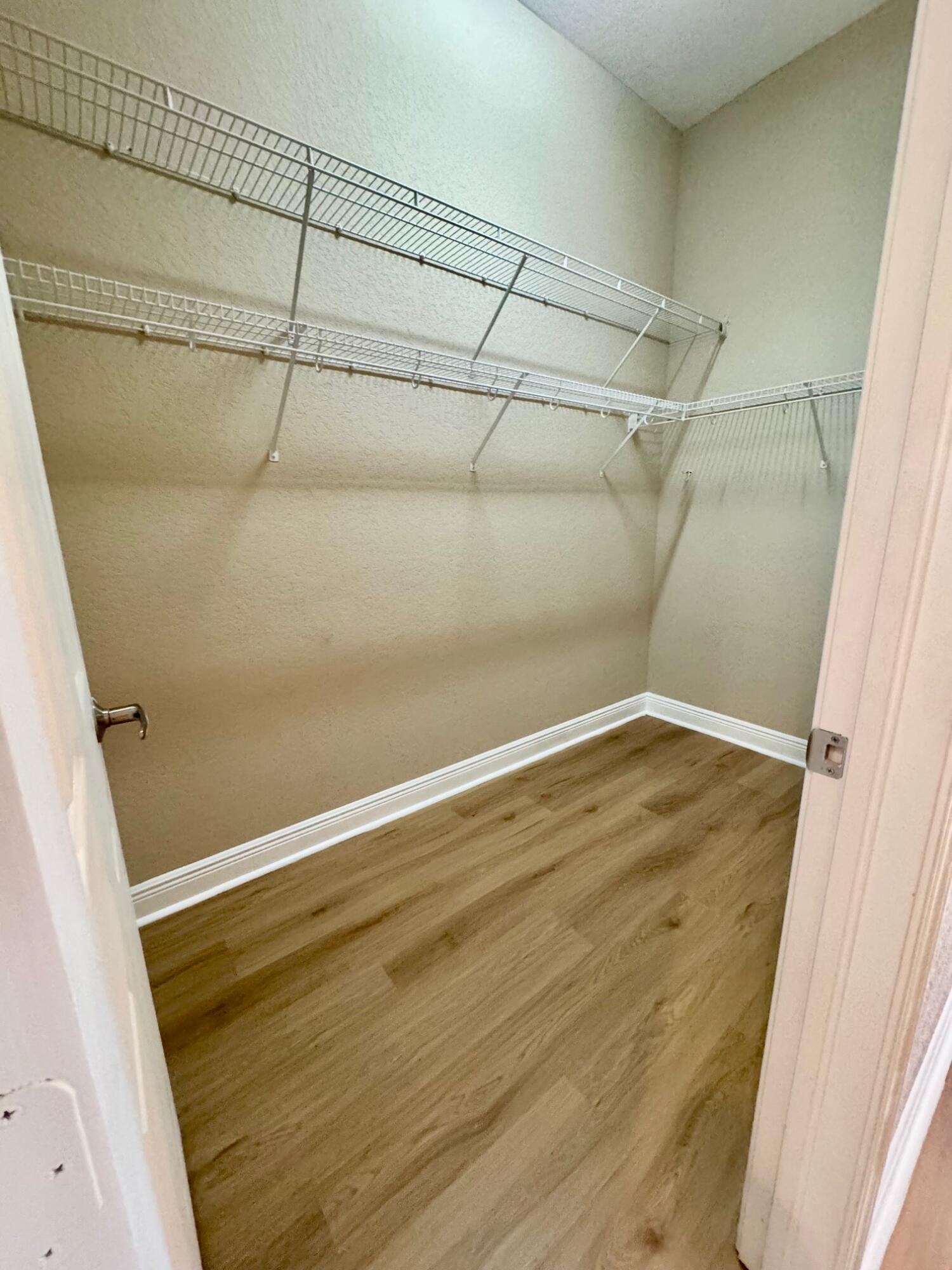 243 Southeast Ethan Terrace Stuart, FL 34997 - Photo 29 of 58 a view of a room with racks on the wall