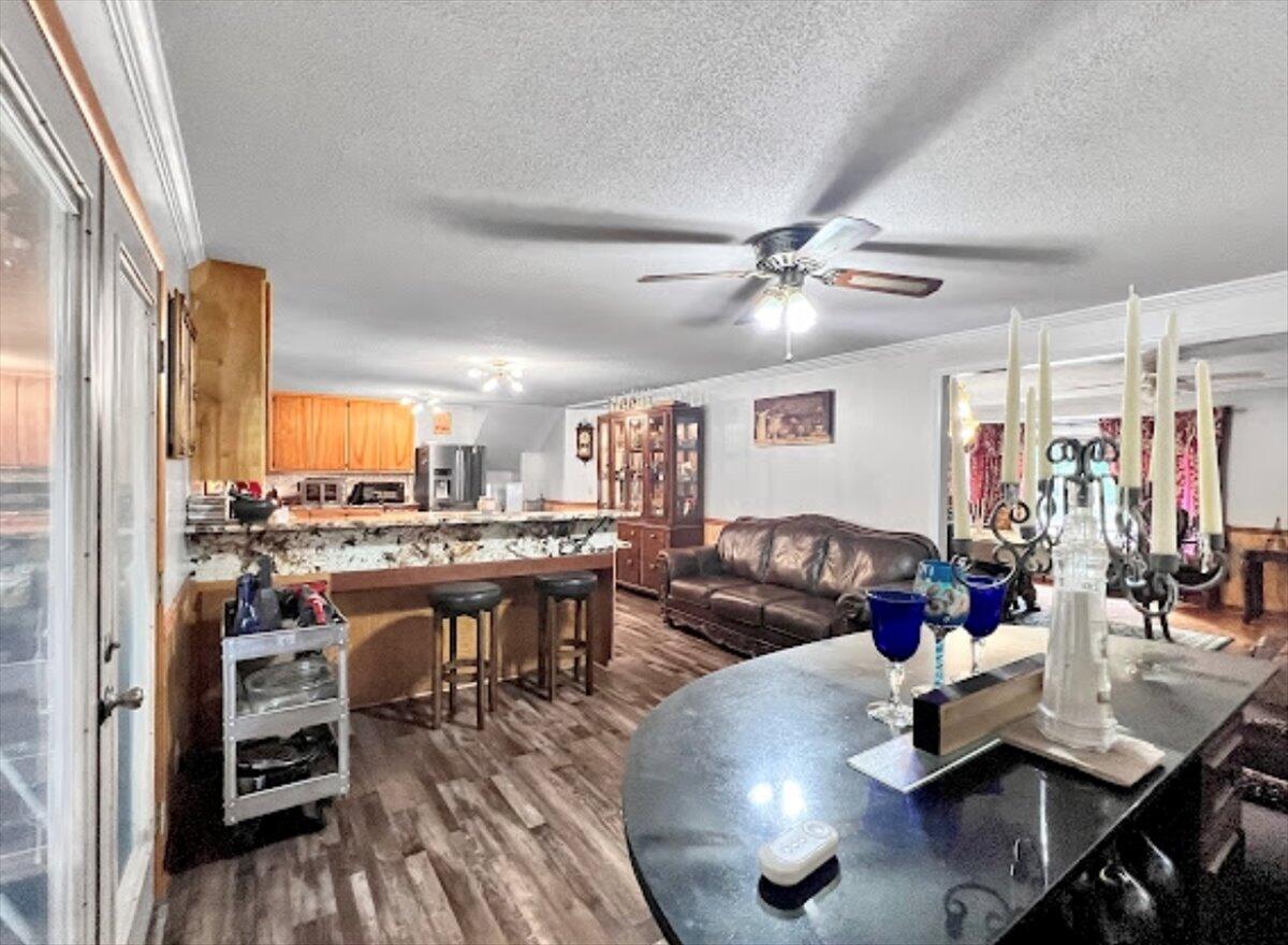 3194 Bay Ridge Drive Crestview, FL 32539 - Photo 24 of 88 a living room with furniture kitchen view and a large window