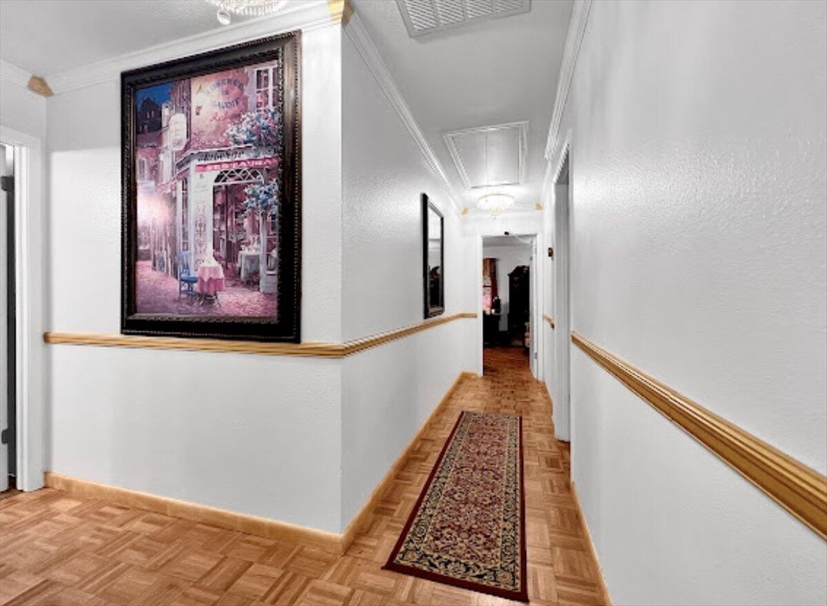 3194 Bay Ridge Drive Crestview, FL 32539 - Photo 50 of 88 a view of a hallway with wooden floor and a carpet