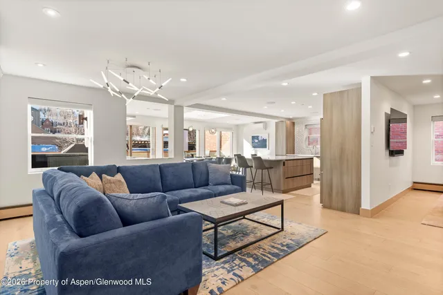 a living room with furniture and a table