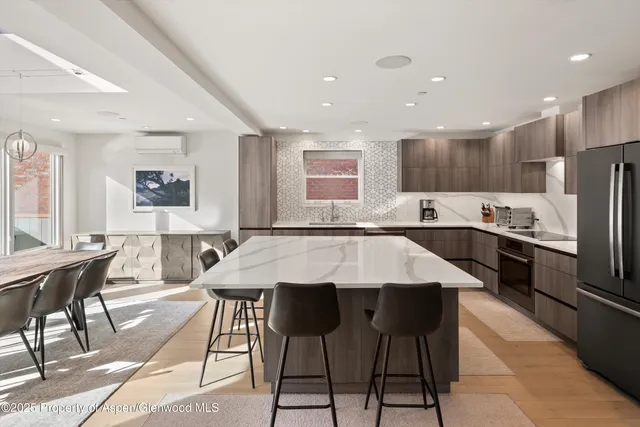 a kitchen with granite countertop lots of counter top space and dining table