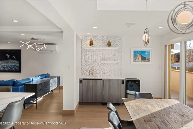 a bedroom with a bed couch and window