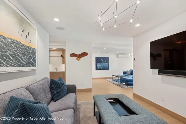 a bathroom with a sink a mirror and shower