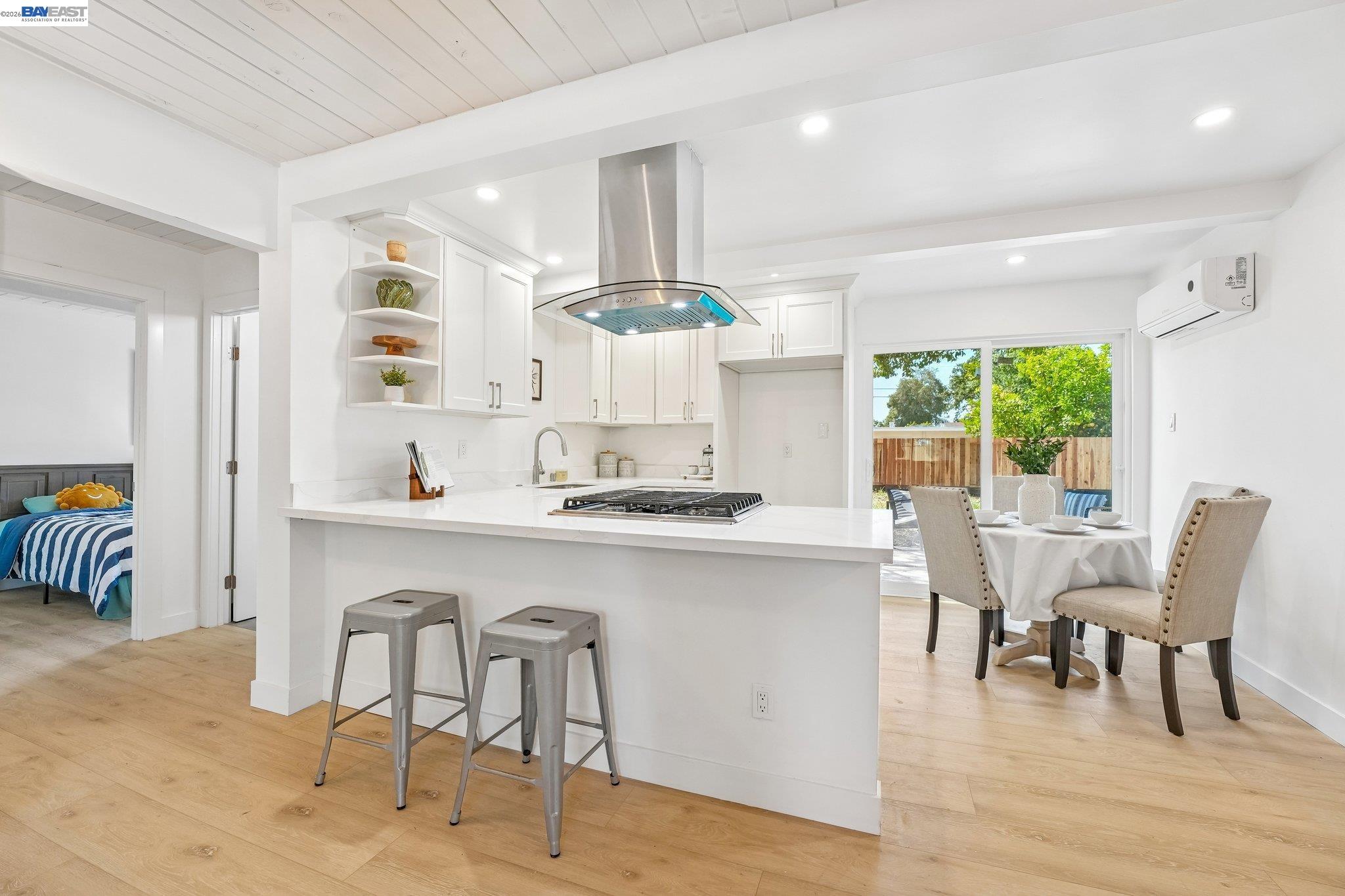 606 West 9th Street Santa Rosa, CA 95401 - Photo 24 of 52 a kitchen with a table chairs sink and cabinets