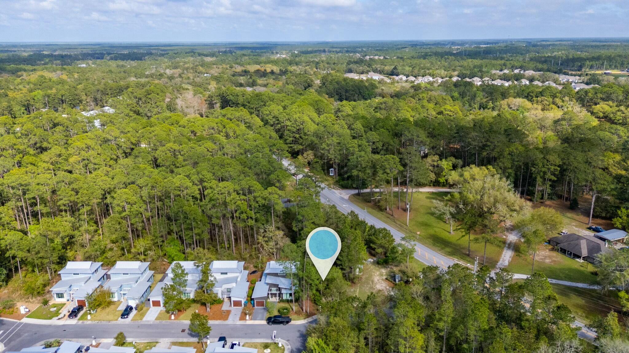 Lot 6 Edens Landing Circle Santa Rosa Beach, FL 32459 - Photo 7 of 14 a view of a house with a swimming pool and a yard