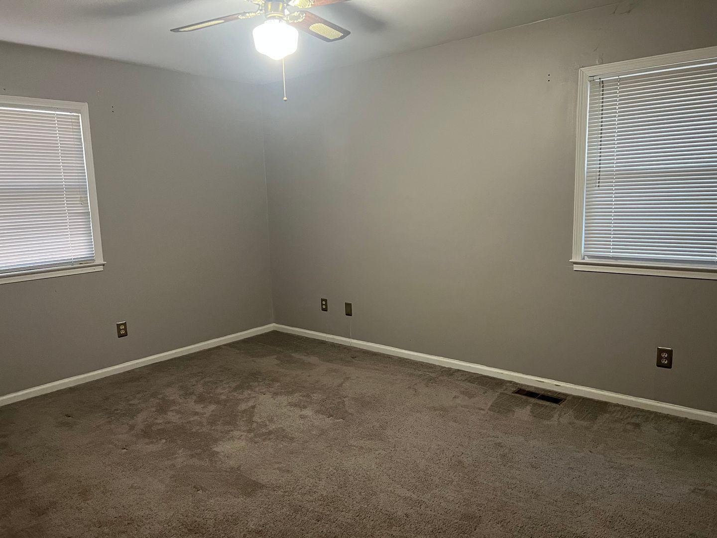 5912 Pine Tree Court Raleigh, NC 27609 - Photo 15 of 18 an empty room with a window