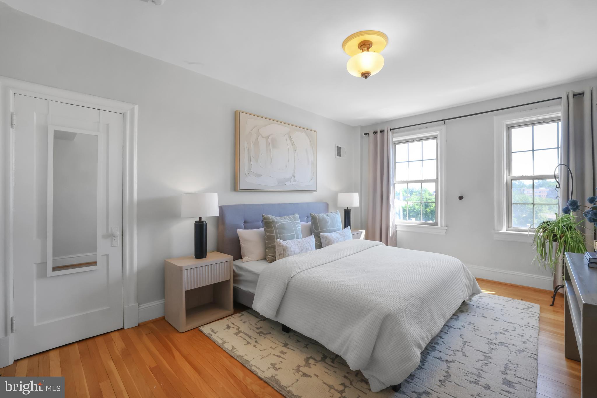 3446 Connecticut Avenue Northwest, Unit 502 Washington, DC 20008 - Photo 18 of 35 a bedroom with a bed and a window