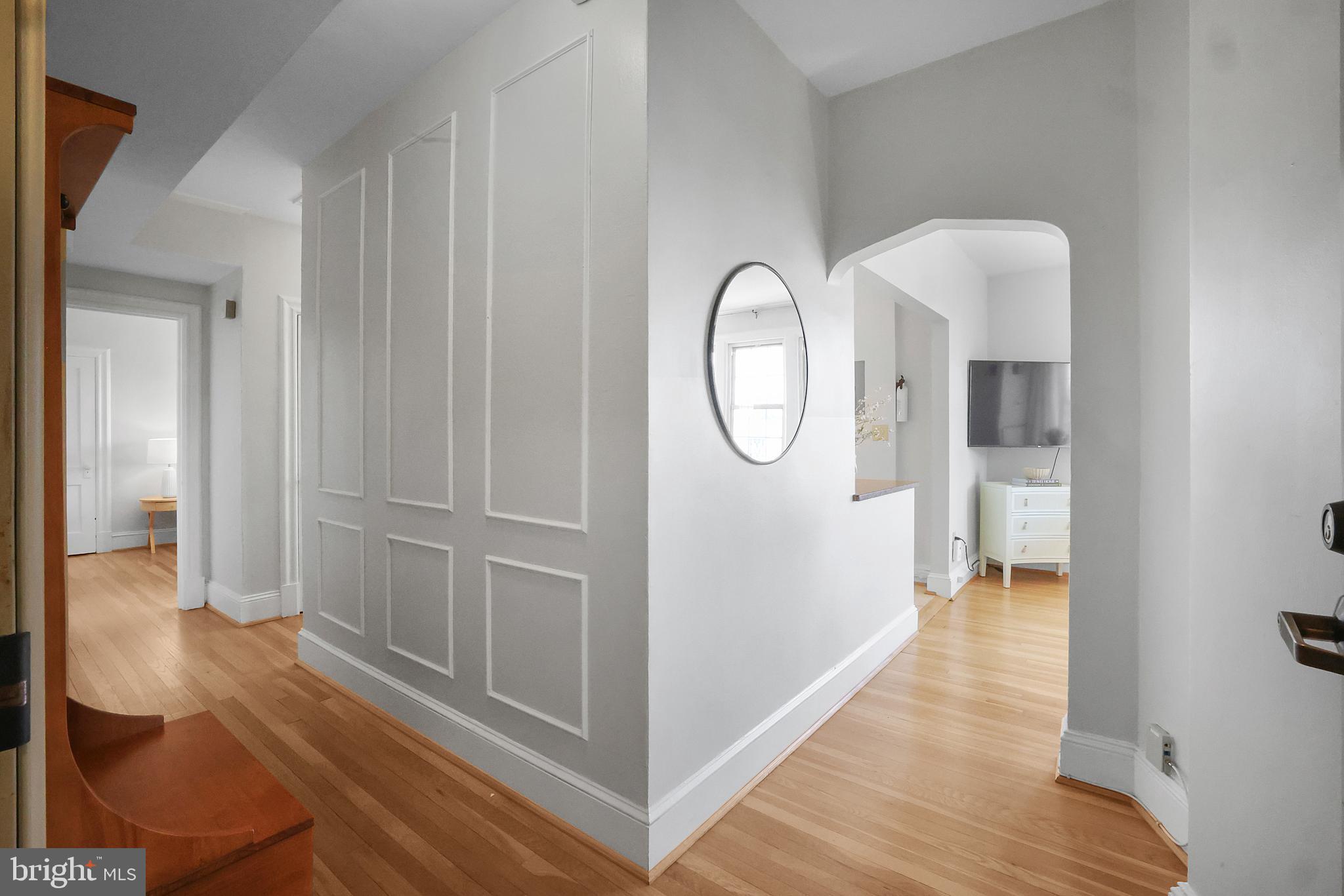 3446 Connecticut Avenue Northwest, Unit 502 Washington, DC 20008 - Photo 2 of 35 a view of a hallway with wooden floor and glass door