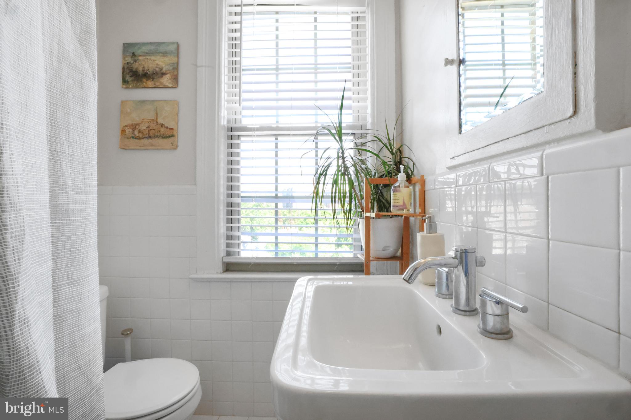 3446 Connecticut Avenue Northwest, Unit 502 Washington, DC 20008 - Photo 22 of 35 a bathroom with a sink and a toilet