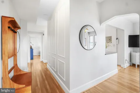 a bedroom with a bed and a table