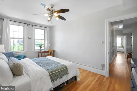 a bedroom with a bed and window