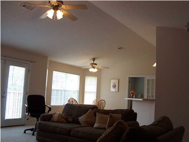 724 Riva Ridge Drive Crestview, FL 32539 - Photo 2 of 4 a living room with furniture and a large window
