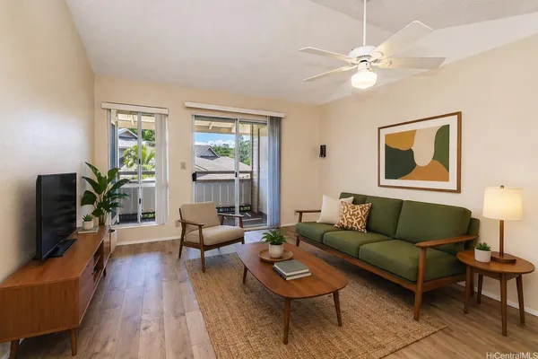 a living room with furniture and a flat screen tv