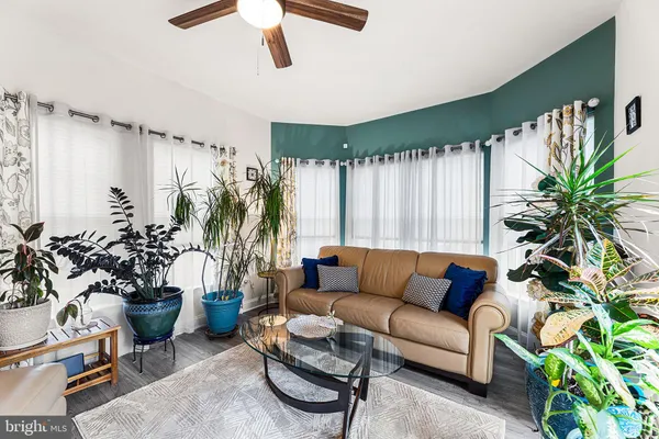 a living room with furniture and a large window