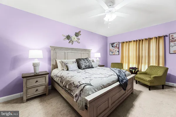a bedroom with a bed and a couch