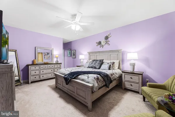 a bedroom with furniture and wooden floor