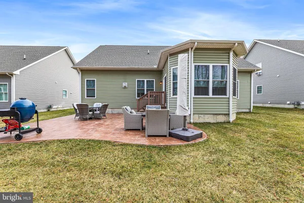 a front view of house with outdoor seating
