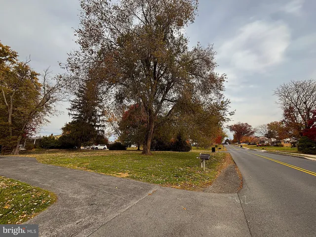 a view of a playground with basketball court