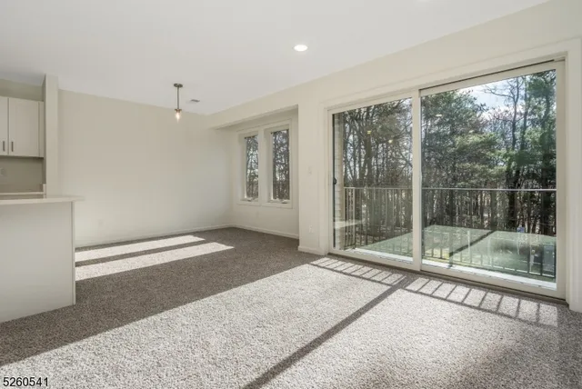 a view of a room with a large window