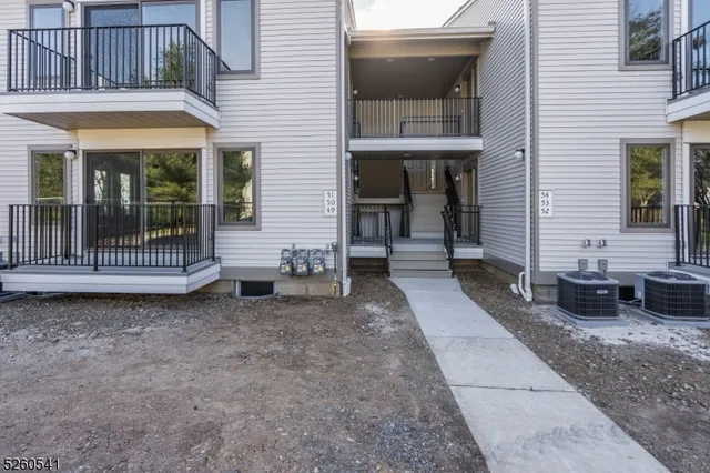 a view of a patio with a table and chairs