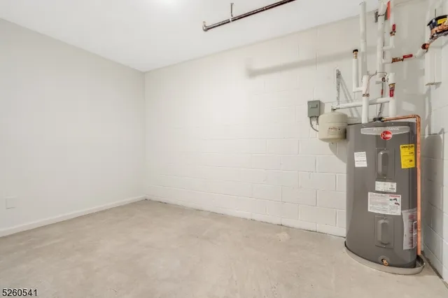 a view of a big room with carpet and windows