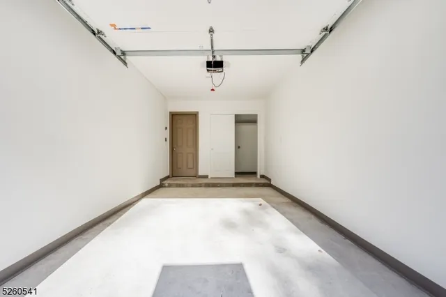 a view of a garage with wooden floor